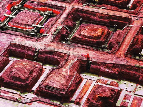 Rough red square panels sit within metal frames fitted with visible bolts, brackets, and springs.