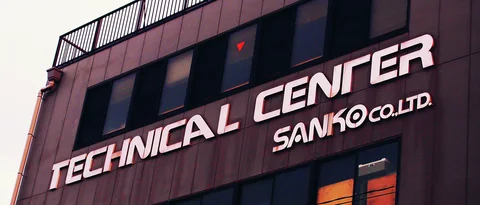 Large pale Technical Center lettering spans a dark building facade beneath a row of windows.